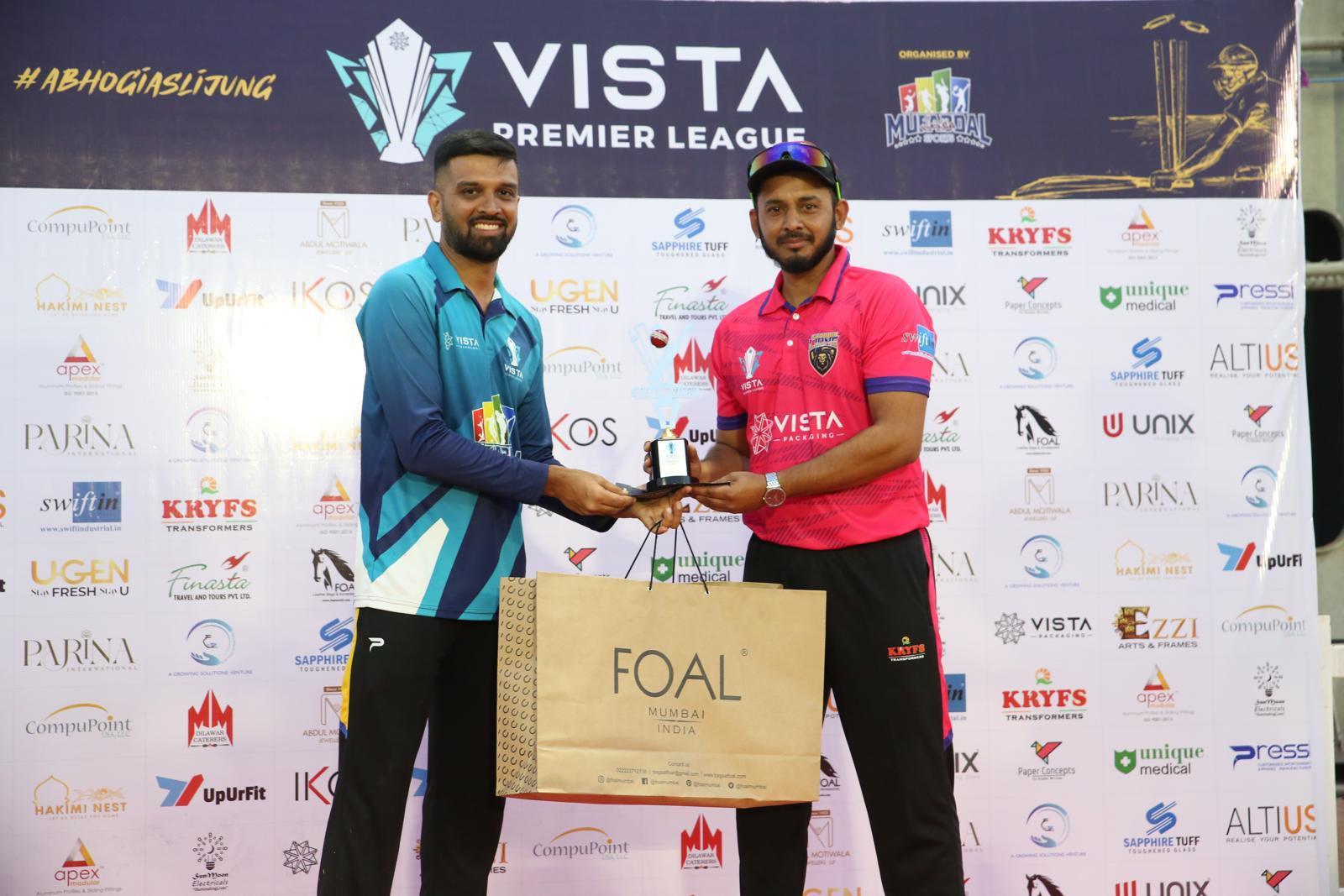 Match award presented in front of the sponsor wall